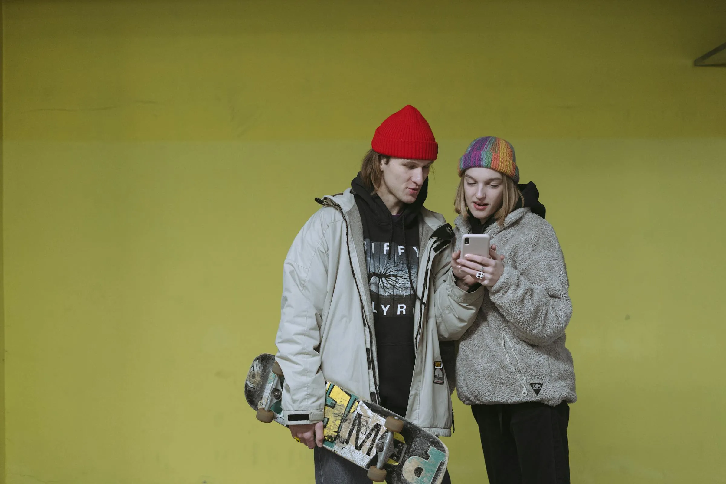 Two friends sharing a moment looking at a phone screen together
